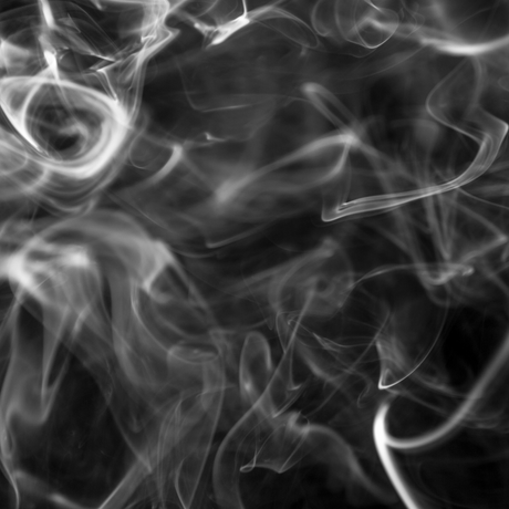 white smoke against black background