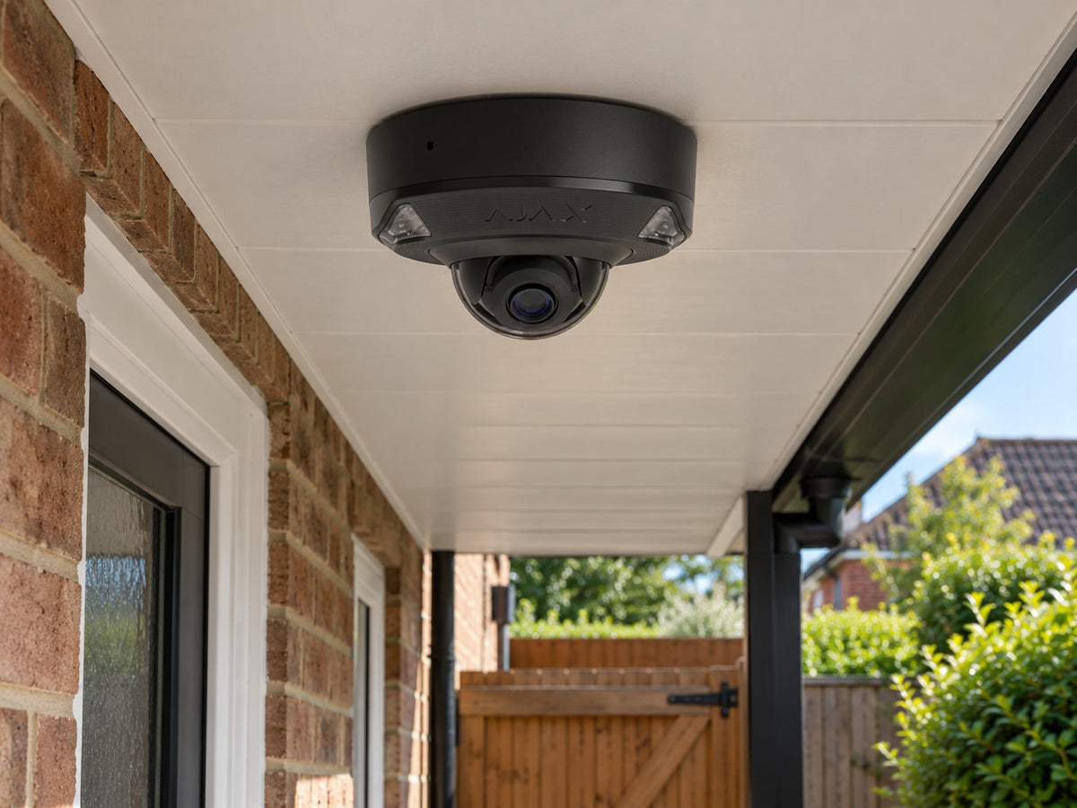 Ajax DomeCam Mini HL • 5MP 4mm • Black installed in British detached home covered side passage and garden gate.