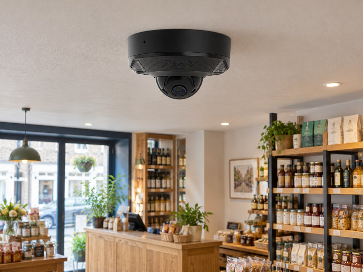 Ajax DomeCam Mini HL • 8MP 4mm • Black installed in neat British independent shop interior.