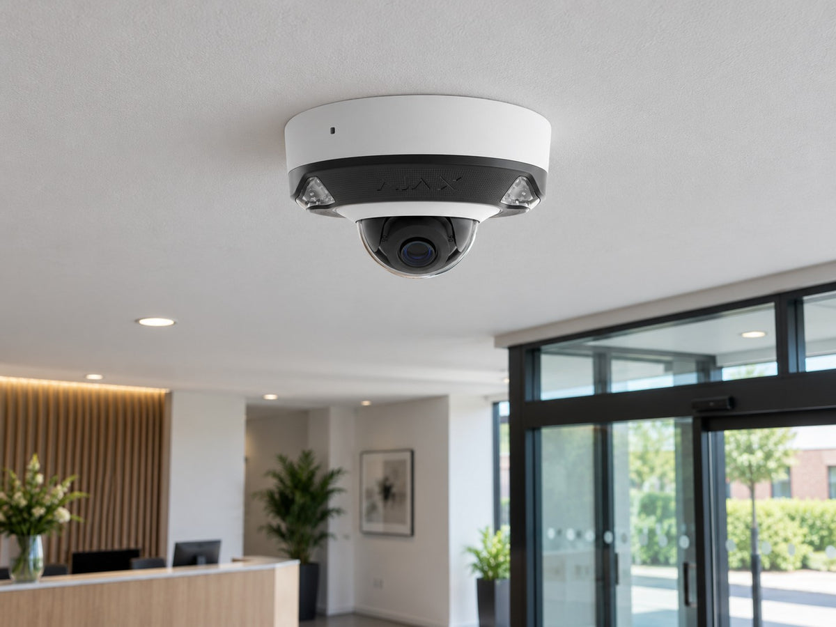 Ajax DomeCam Mini HL • 8MP 4mm • White installed in modern British office reception.