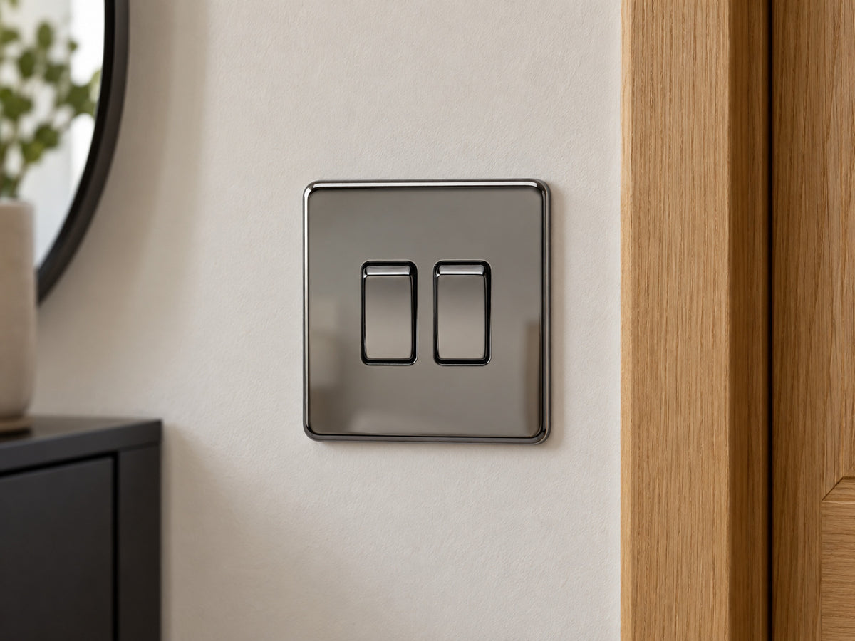 Knightsbridge SF3000BN black nickel light switch fitted on a UK hallway wall beside an oak door frame.