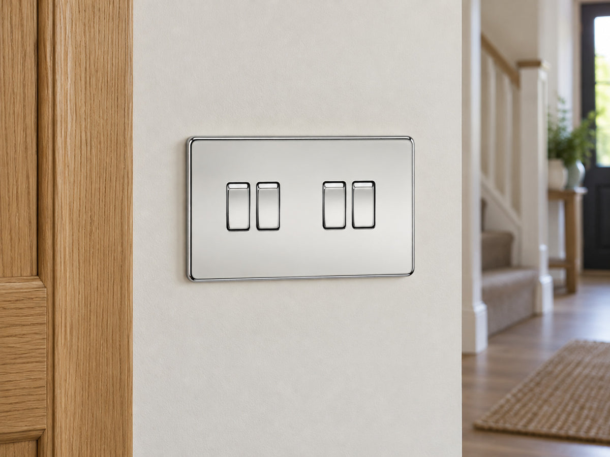 Knightsbridge SF4100PC polished chrome light switch installed on a UK hallway wall beside an oak door frame.