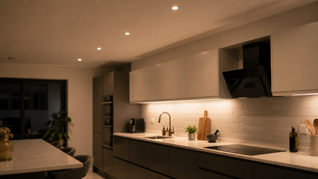 Recessed LED downlights lit in a modern kitchen ceiling above a worktop