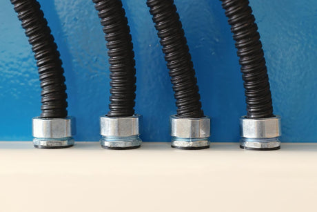 The new electrical wires in the corrugated protection are attached to the cable duct by means