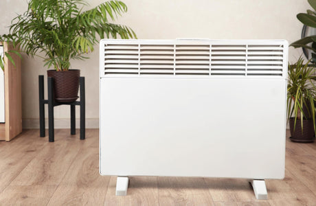 Modern electric heater on floor at home 