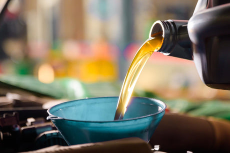 oil being poured into a funnel 