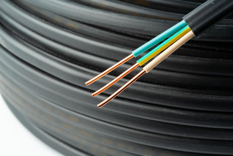 Close up of black electrical wire coil with blue and white wires