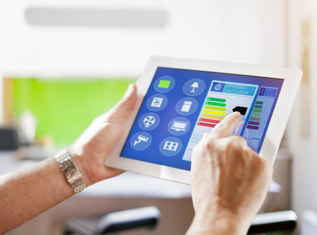 Cropped hands using digital tablet at home