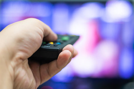 Cropped hand using remote control