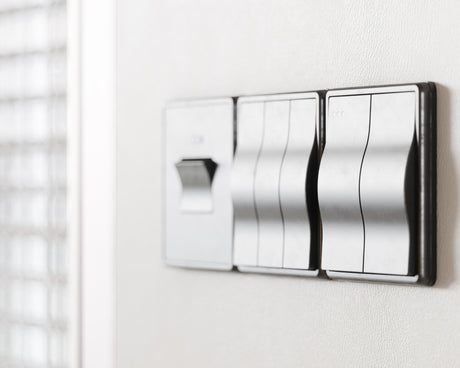 modern polished light switches on home wall
