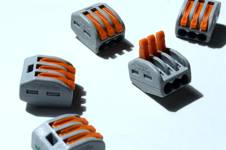 Clamping terminal blocks lie on a light background. close-up.