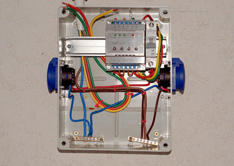 Multicoloured wires are laid in the electrical panel