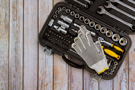 tool kit on wooden table 