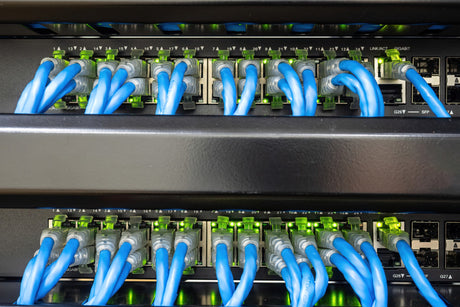 Network switch and ethernet cable connect to computer system