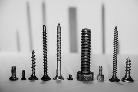 Close-up of screws on table