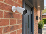 Ajax BulletCam • 5MP 4mm • White installed in British red-brick shop side entrance.