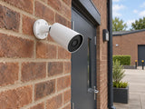Ajax BulletCam • 8MP 2.8mm • White installed in British small business courtyard.