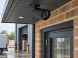 Ajax BulletCam HL in a small business loading entrance beneath a canopy.
