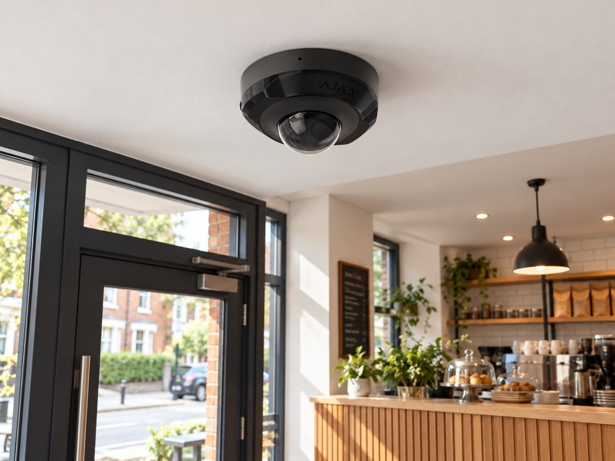 Ajax DomeCam Mini • 8MP 4mm • Black installed in British cafe entrance.
