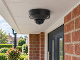 Ajax DomeCam Mini HL • 8MP 4mm • Black installed in British red-brick home entrance porch, front door and small garden beyond.