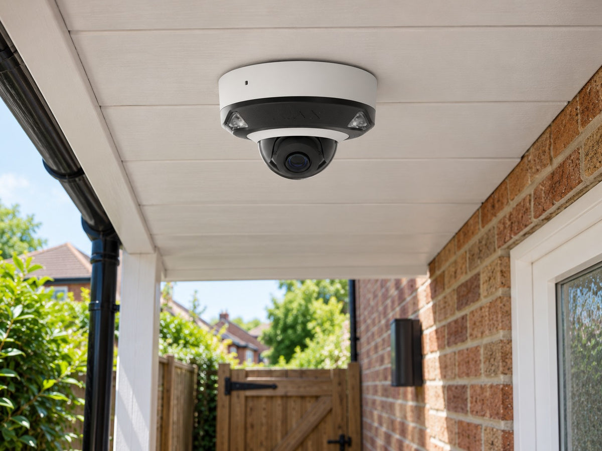 Ajax DomeCam Mini HL • 8MP 4mm • White installed in British detached home covered side passage and garden gate.