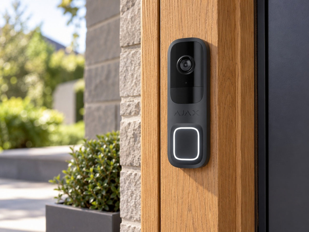 Ajax DoorBell Graphite shown at a timber entrance frame.