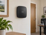 Ajax Hub 2 Plus • Black installed in small British office administration room.