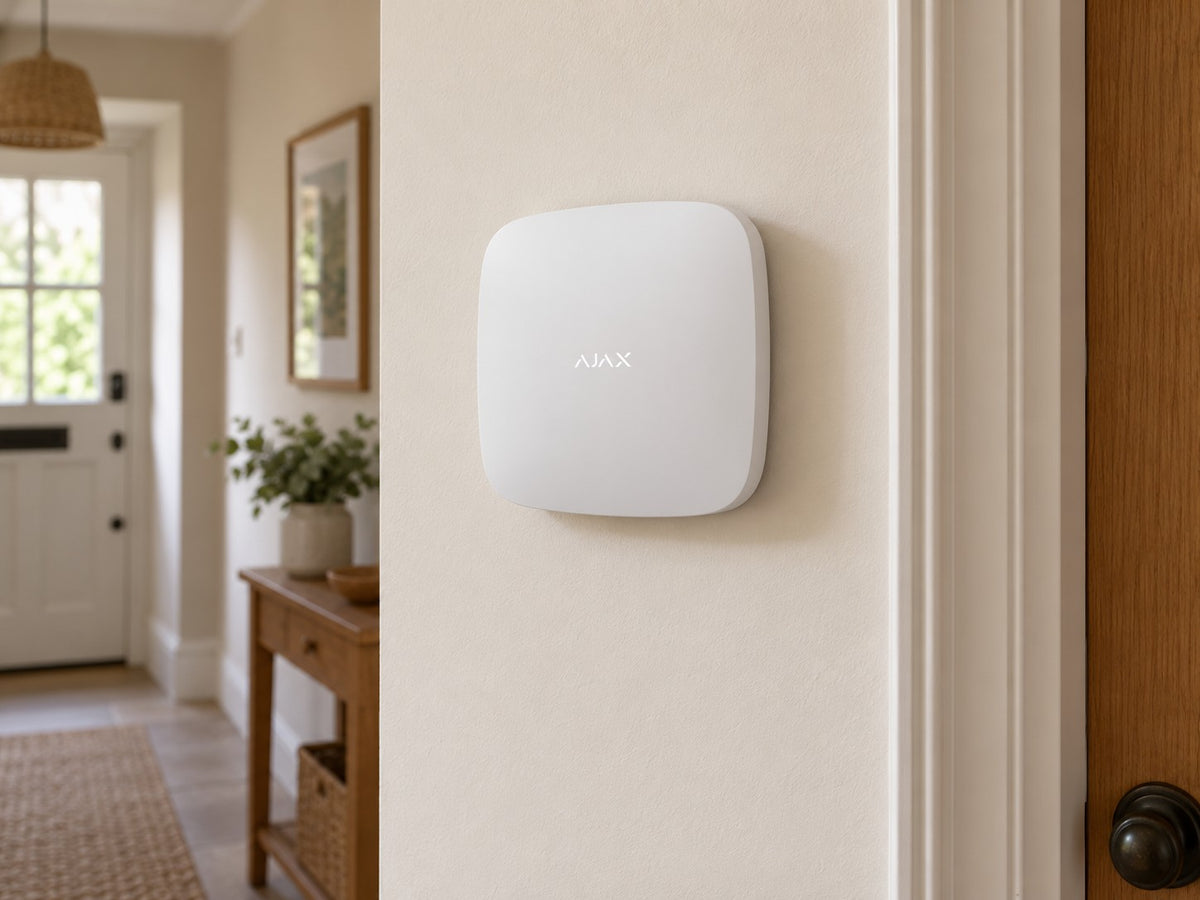 Ajax Hub 2 Plus • White installed in calm British home utility hallway.