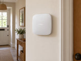 Ajax Hub 2 Plus • White installed in calm British home utility hallway.