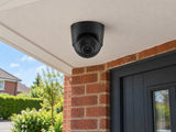 Ajax TurretCam • 8MP 4mm • Black installed in British red-brick home entrance porch, front door and small garden beyond.
