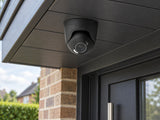 Ajax TurretCam HL • 5MP 2.8mm • Black installed in dark-trim British home porch soffit.