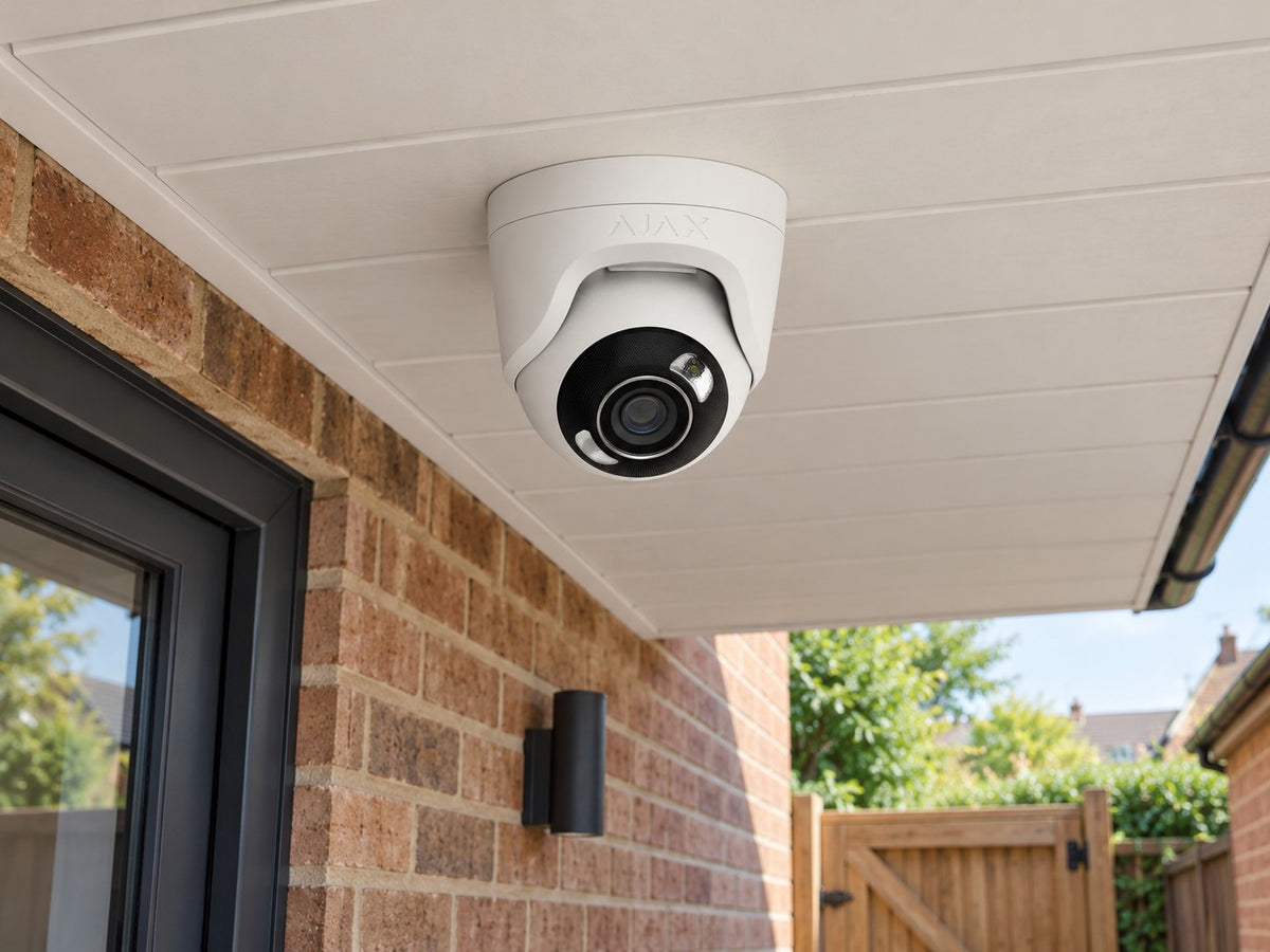 Ajax TurretCam HL • 8MP 2.8mm • White installed in British detached home covered side passage and garden gate.