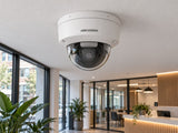 Hikvision DS-2CD2146G2H-ISU (white) installed in British coworking space lobby.