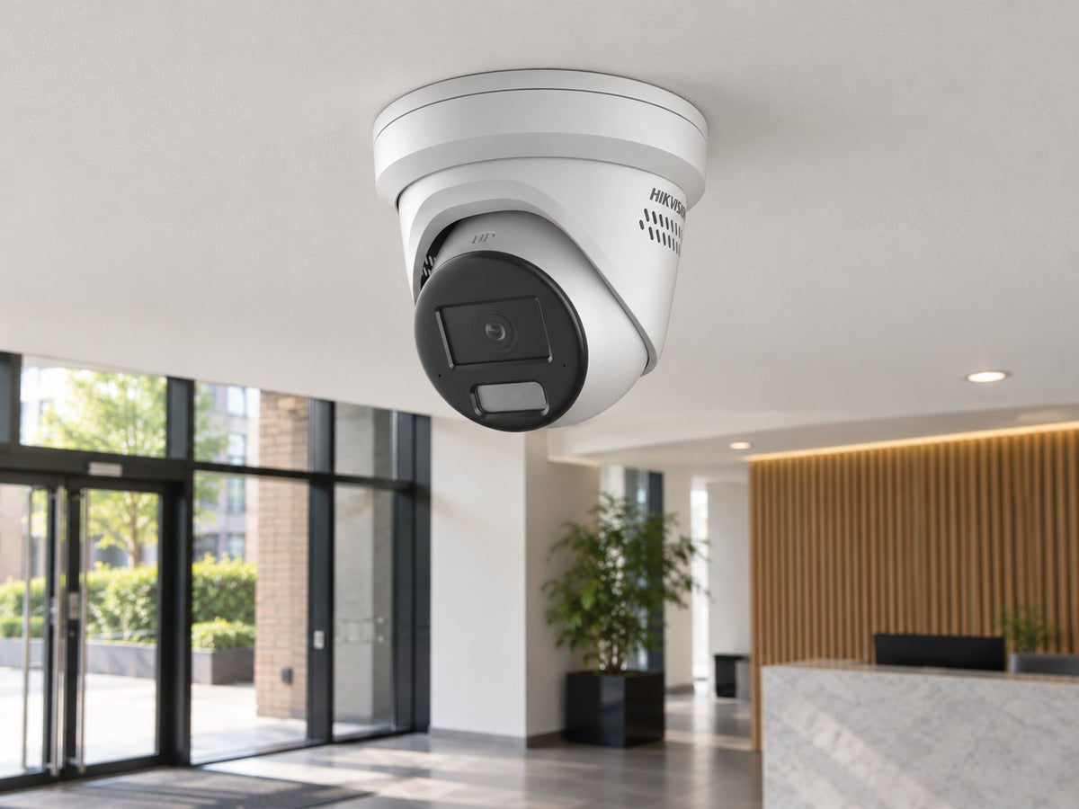 Hikvision DS-2CD2346G2H-IS2U/SL (white) installed in British professional office lobby.