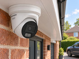 Hikvision DS-2CD2387G3-LI2UY above a driveway.