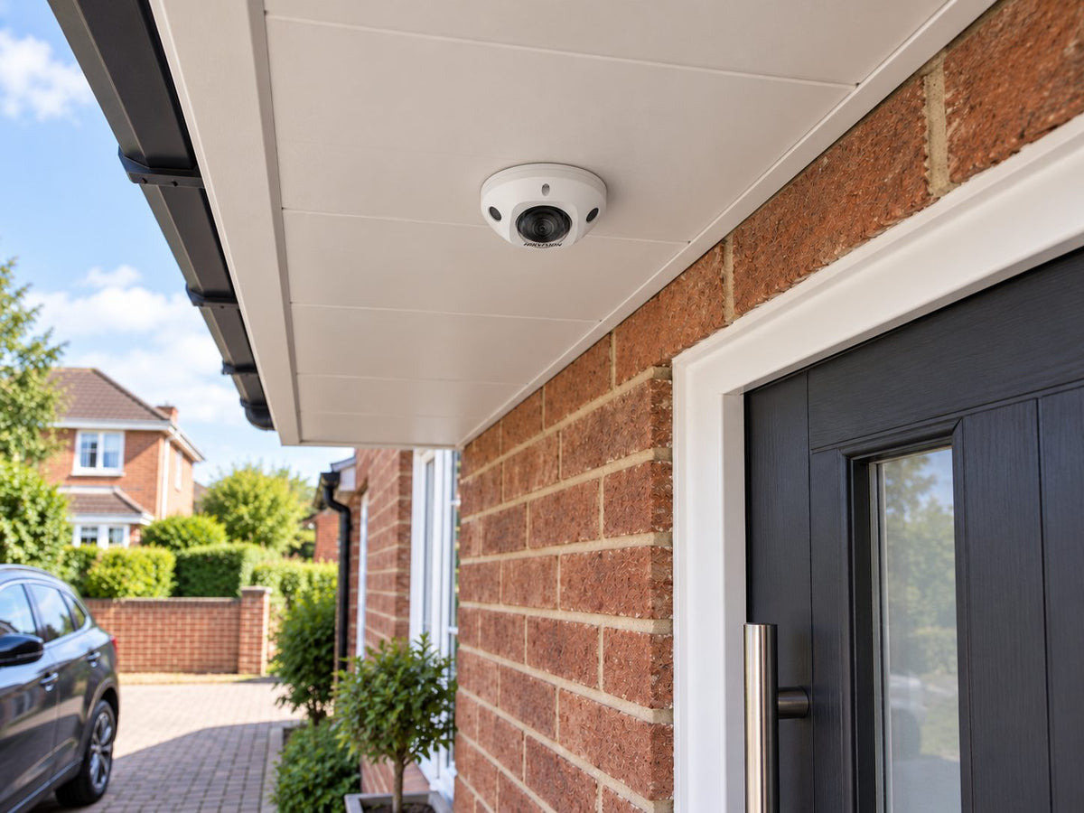 DS-2CD2526G2-IS in an illustrative building entrance setting.