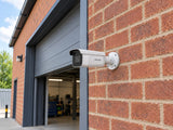 Hikvision DS-2CD2643G2-IZS installed in British brick workshop entrance.