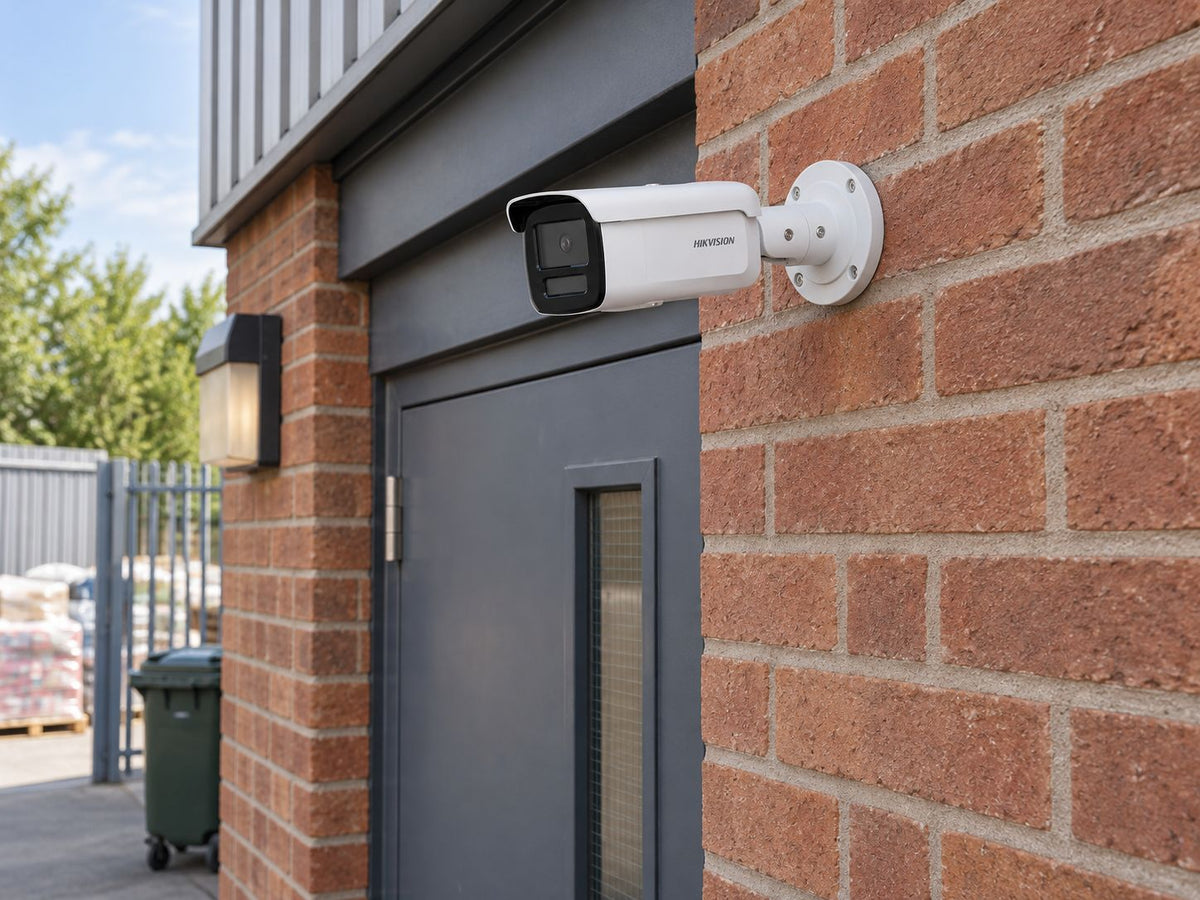 Hikvision DS-2CD2T46G2H-2I installed in British independent shop service entrance.