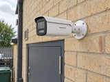 Hikvision DS-2CD2T47G3-LIY (White) installed in British independent shop service entrance.