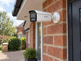 Hikvision DS-2CD2T47G3-LIY (White) installed in British red-brick home entrance.