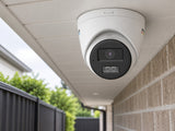 Hikvision DS-2CE72KF3T-LSYE (2.8 mm) shown at an exterior entrance.
