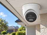 Hikvision DS-2CE72KF3T-LSYE (2.8 mm) shown at a brick house exterior.