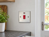 Knightsbridge FP8331NPC polished chrome double-pole switch installed in a dry UK kitchen utility wall away from water and heat.