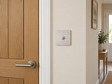 Knightsbridge SF1TOGBC brushed chrome toggle switch fitted flush in UK hallway beside a timber doorway.