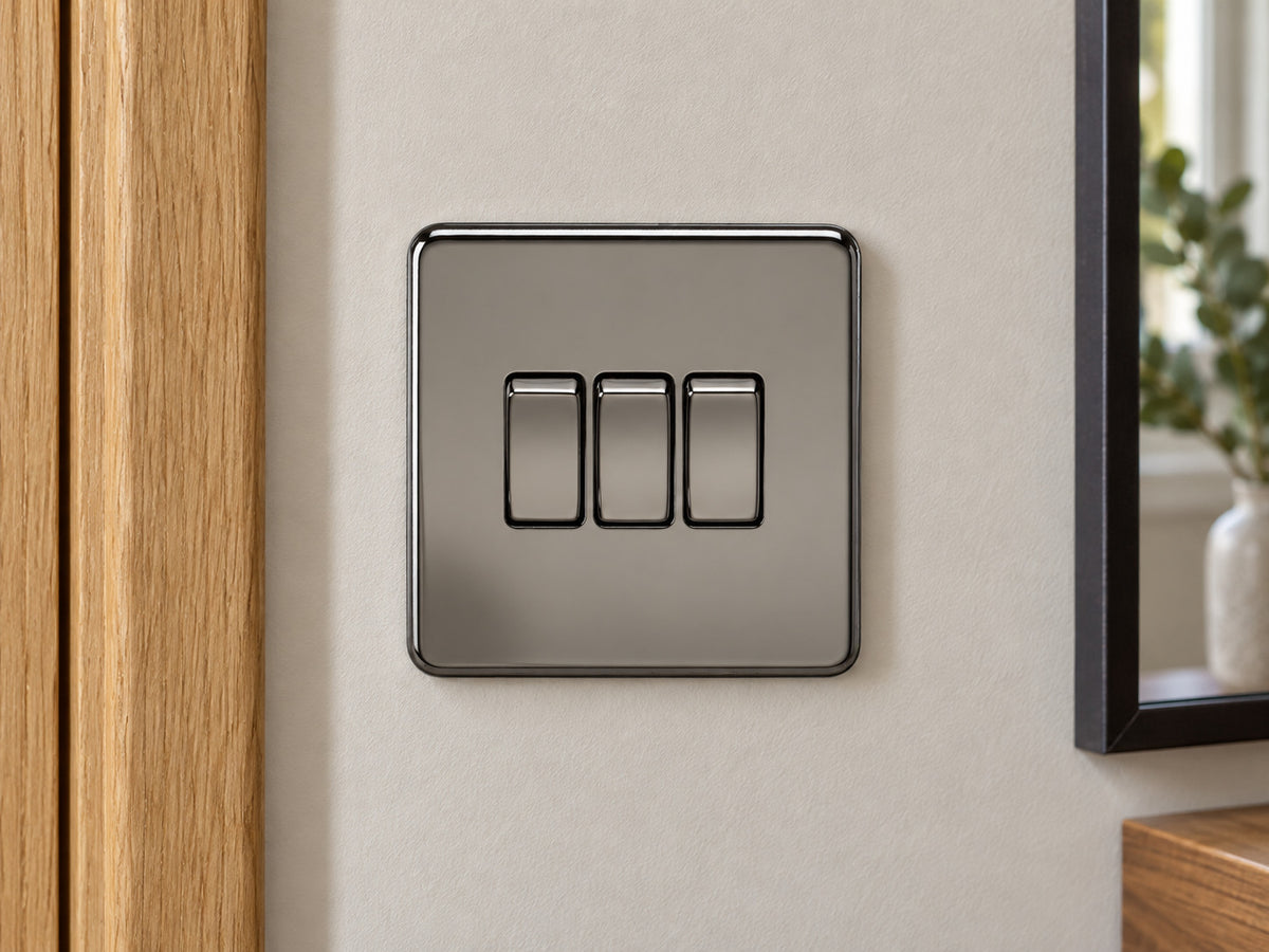 Knightsbridge SF4000BN black nickel light switch fitted on a UK hallway wall beside an oak door frame.