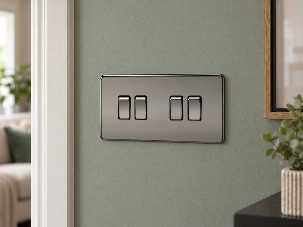 Knightsbridge SF4100BN black nickel light switch fitted on a UK living-room entrance wall with muted sage paint.